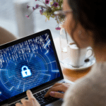 A woman engaged with her laptop, inputting a security code, highlighting the importance of cybersecurity.