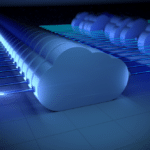 Cloud icons illuminated by a blue light, symbolizing hybrid cloud technology.