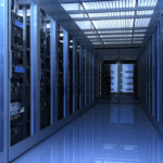 A long hallway lined with rows of servers, showcasing a modern IT infrastructure environment.